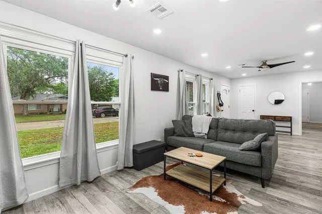 a living room with furniture and a window