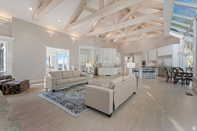 3222 Eagle View Circle Sandy, UT 84092 - Photo 13 of 60 Living room with light wood finished floors, wine cooler, and suspended lighting