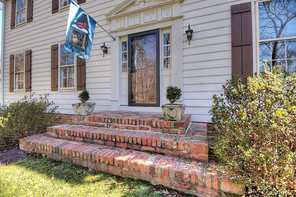 14011 Helmsley Road Midlothian, VA 23113 - Photo 28 of 43 a view of a house with a small yard and wooden fence