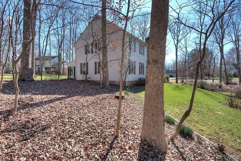 14011 Helmsley Road Midlothian, VA 23113 - Photo 35 of 43 a view of a garden with a house