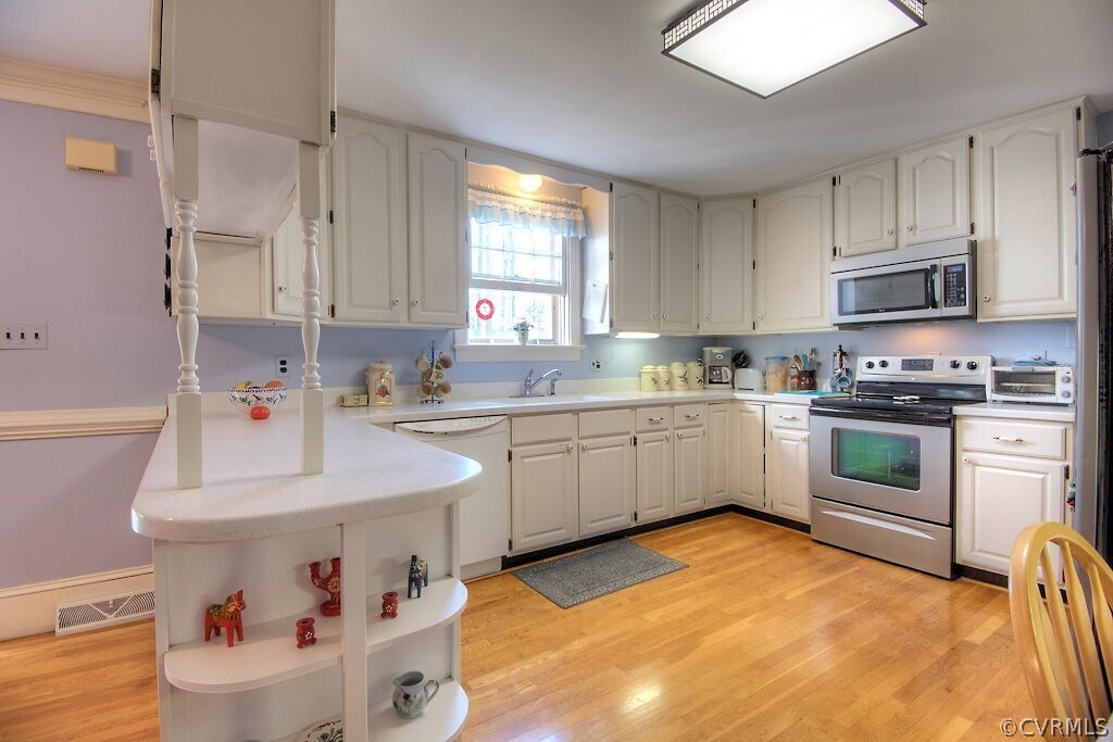 14011 Helmsley Road Midlothian, VA 23113 - Photo 6 of 43 a kitchen with a sink cabinets and appliances