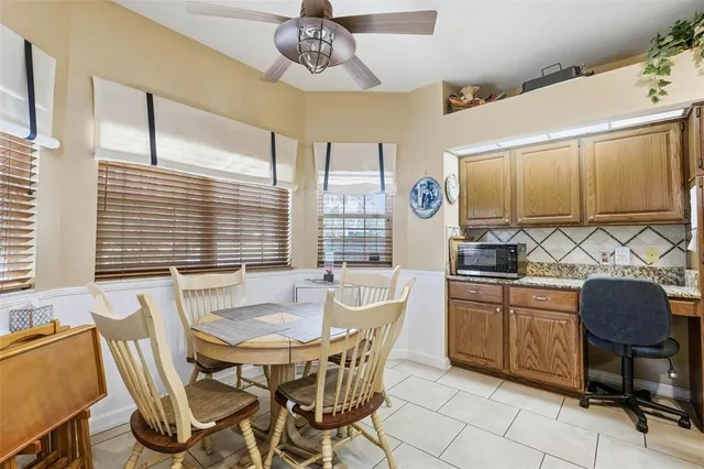 a dining room with furniture and window