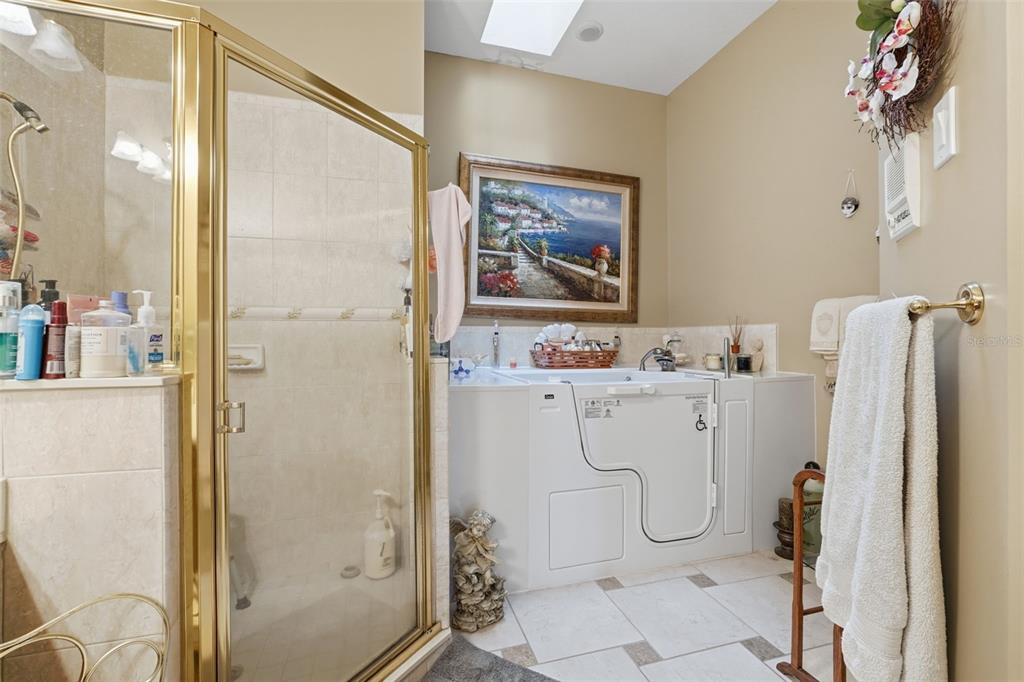 4870 Watervista Drive Orlando, FL 32821 - Photo 22 of 36 a bathroom with a shower