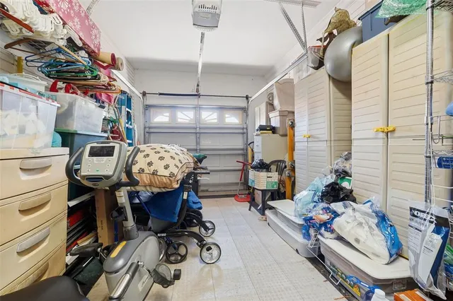 a view of gym equipment with furniture and clothes