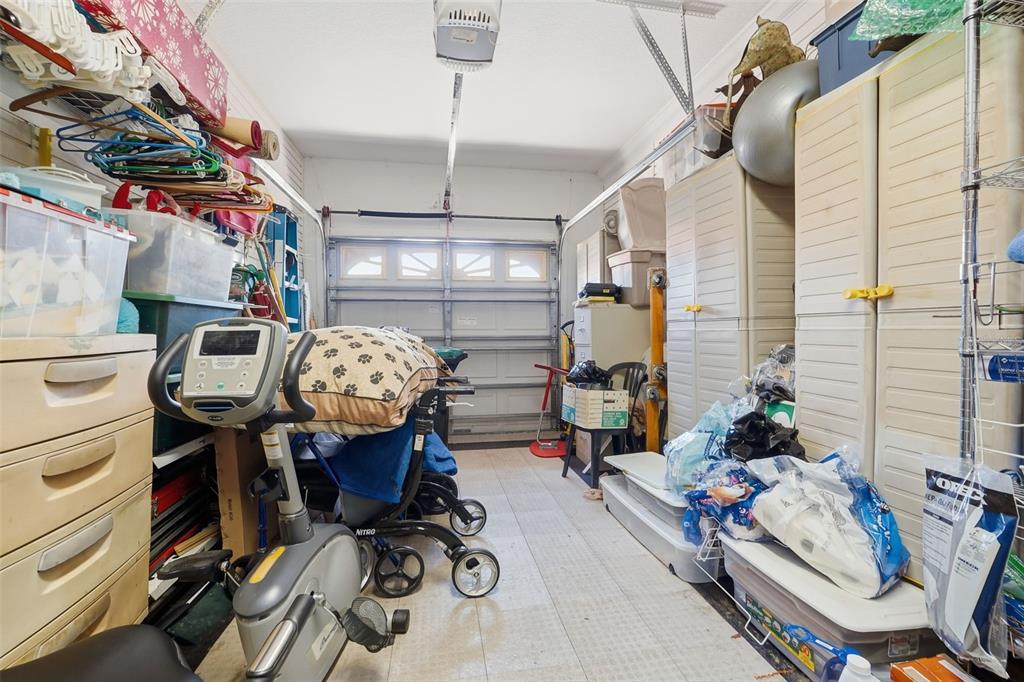 4870 Watervista Drive Orlando, FL 32821 - Photo 26 of 36 a view of gym equipment with furniture and clothes