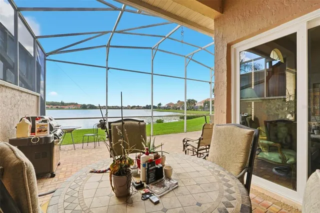 a view of a chairs and table in the patio