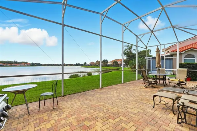 a view of a chair and tables in the patio area