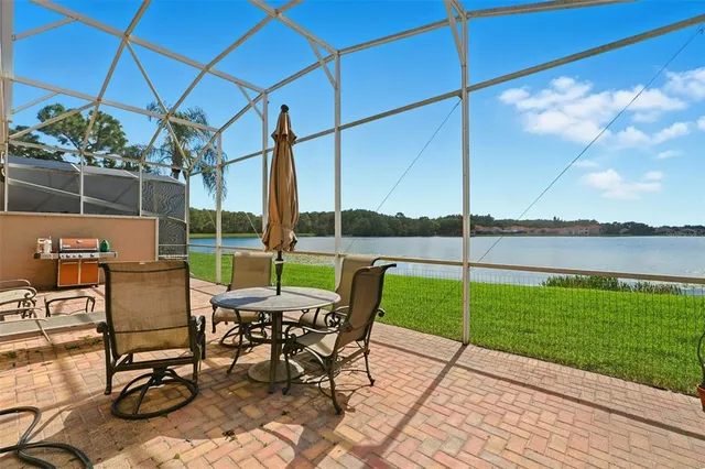 a view of a backyard with sitting area