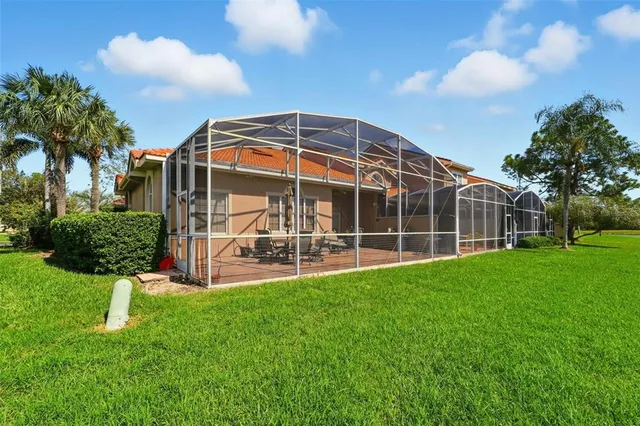 a front view of a house with a yard table and chairs