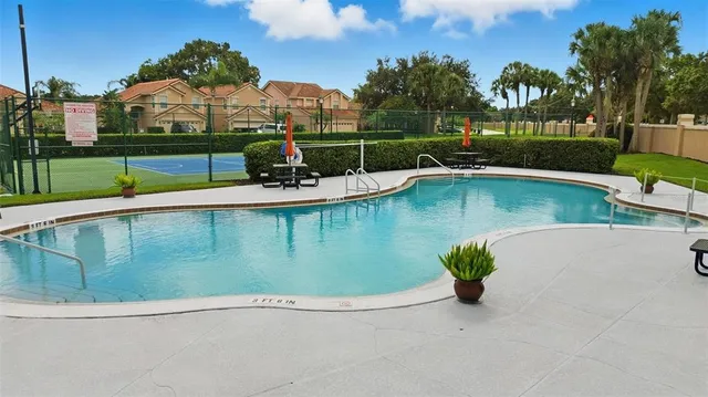 a view of a swimming pool with a lake view