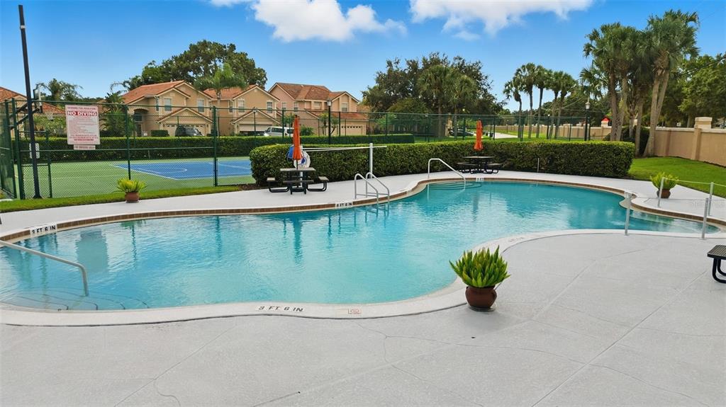 4870 Watervista Drive Orlando, FL 32821 - Photo 36 of 36 a view of a swimming pool with a lake view