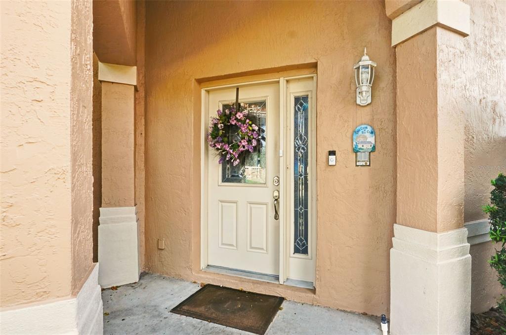 4870 Watervista Drive Orlando, FL 32821 - Photo 4 of 36 a view of a hallway with paintings on the wall