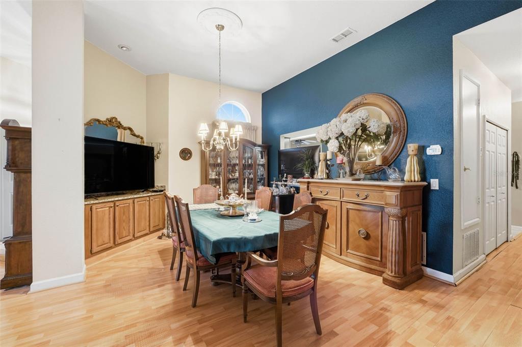 4870 Watervista Drive Orlando, FL 32821 - Photo 6 of 36 a view of a dining room with furniture