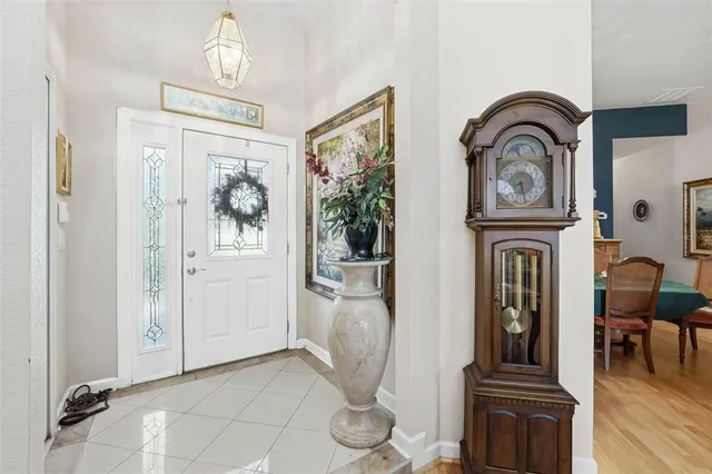 a view of living room with furniture and wooden floor