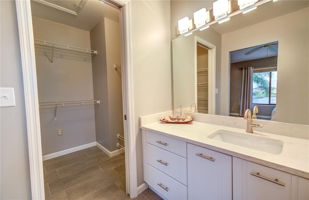 600 Carriage House Lane, Unit 201 Nokomis, FL 34275 - Photo 14 of 23 a bathroom with a sink and a mirror