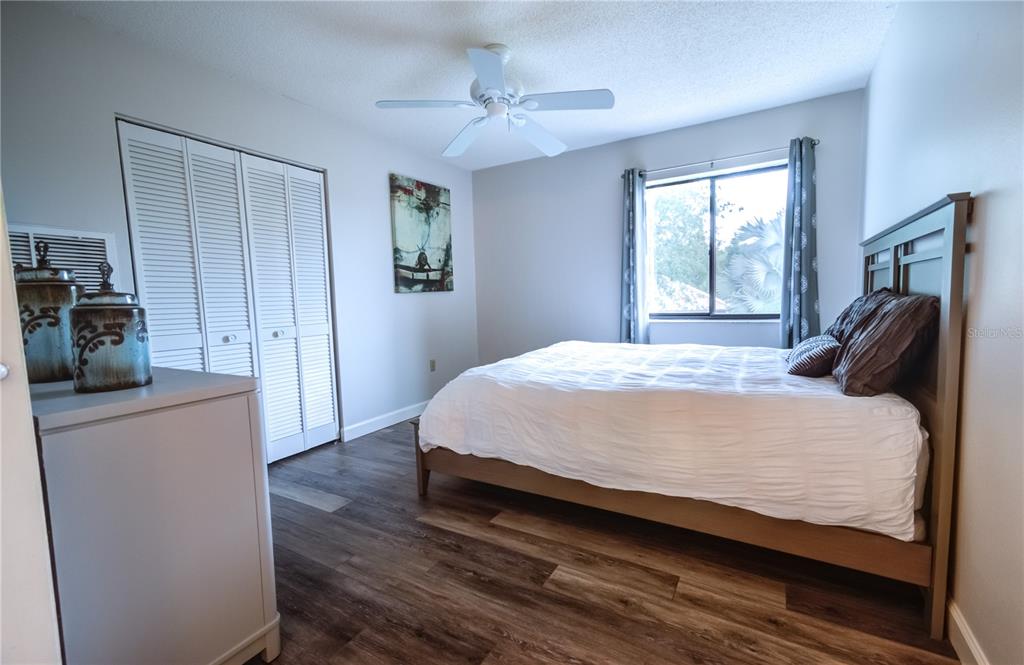 600 Carriage House Lane, Unit 201 Nokomis, FL 34275 - Photo 15 of 23 a bedroom with a bed and a couch
