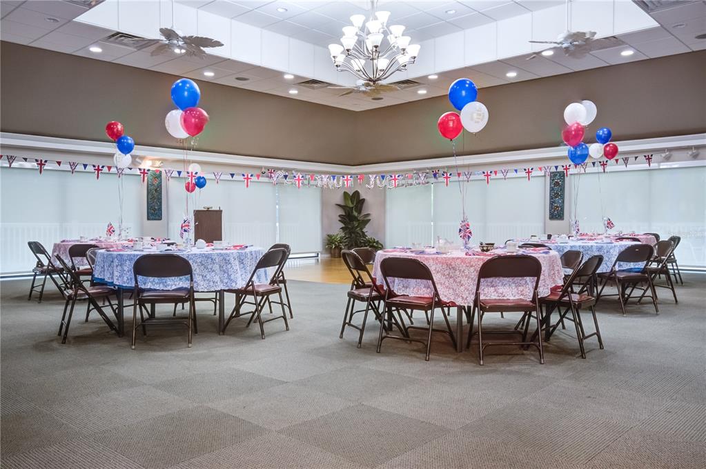 600 Carriage House Lane, Unit 201 Nokomis, FL 34275 - Photo 21 of 23 a view of a dining area with furniture and a chandelier