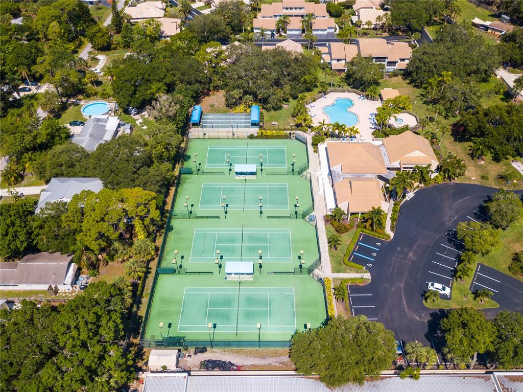 600 Carriage House Lane, Unit 201 Nokomis, FL 34275 - Photo 22 of 23 an aerial view of a residential apartment building with a yard