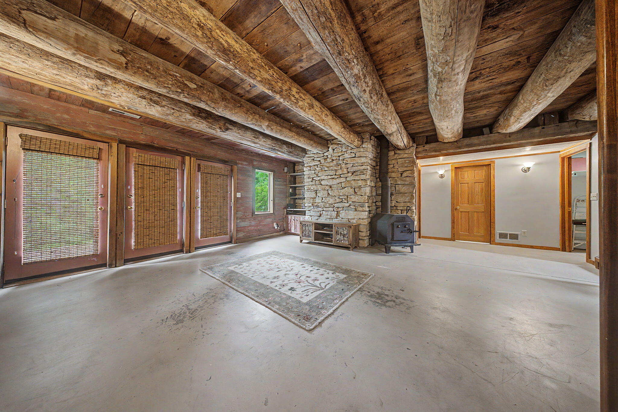 9766 Sullivan Road Union, KY 41091 - Photo 31 of 50 Walkout basement with stone wall, hook up for wood burning stove, and wine cellar.