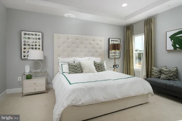 a bedroom with double bed and a couch