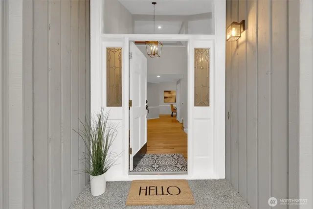 a bathroom with a glass door shower and sink
