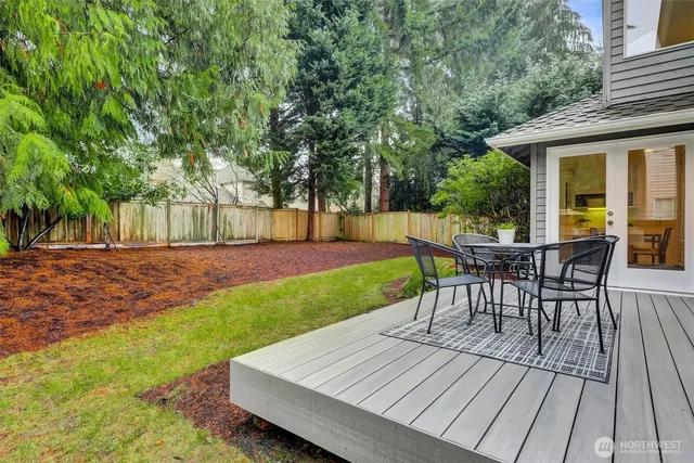 a view of a backyard with sitting area