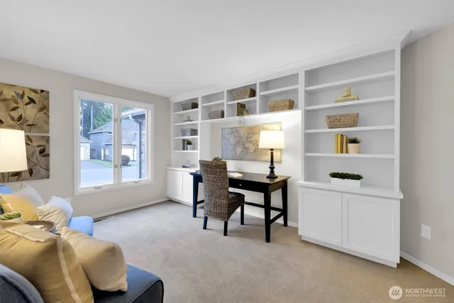 a workspace with furniture and a window