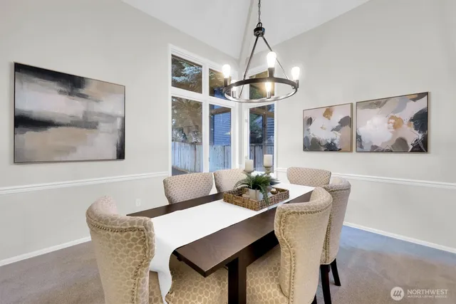 a dining room with furniture and window