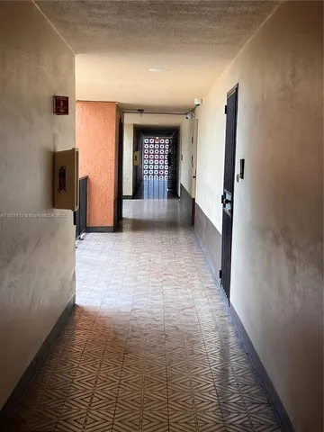 a view of staircase with railing and a window