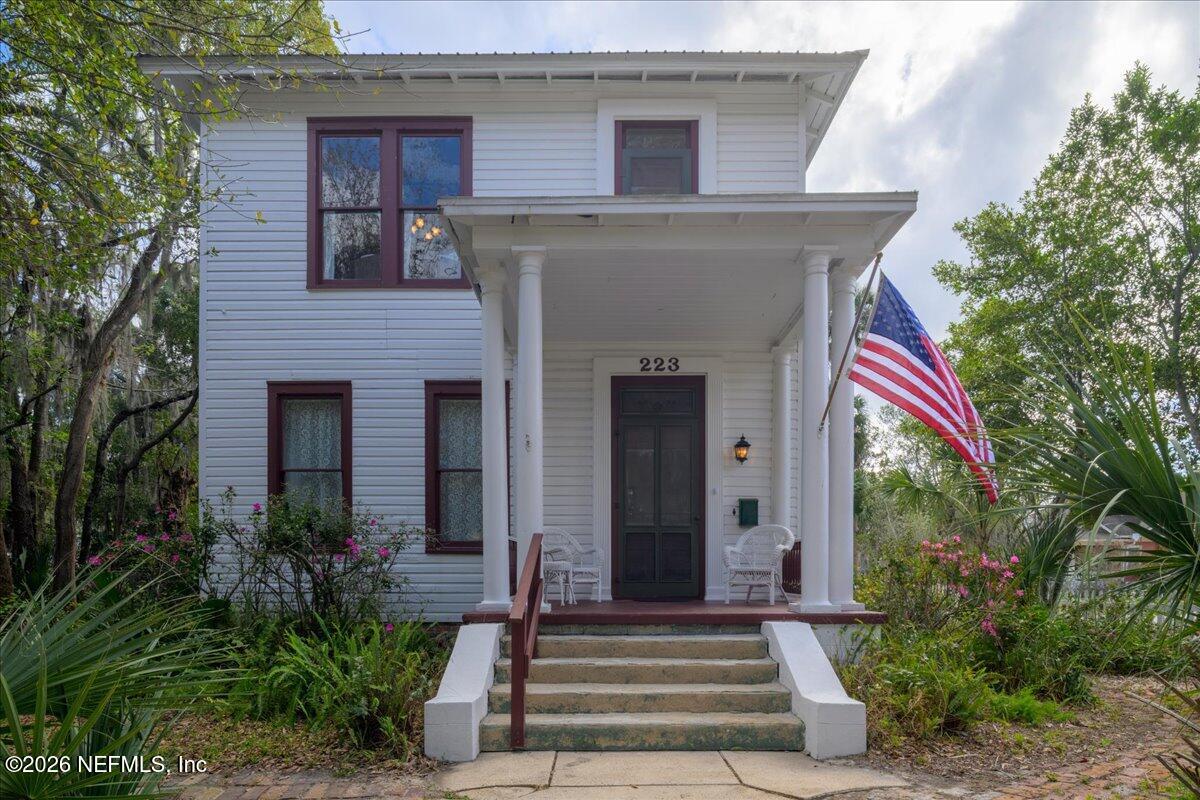 223 Madison Street Palatka, FL 32177 - Photo 1 of 60 a front view of a house with garden