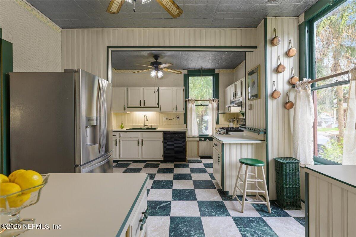 223 Madison Street Palatka, FL 32177 - Photo 17 of 60 a kitchen with stainless steel appliances a refrigerator and a stove