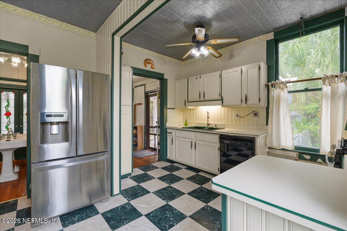 223 Madison Street Palatka, FL 32177 - Photo 18 of 60 a kitchen with granite countertop stainless steel appliances a refrigerator and a stove top oven
