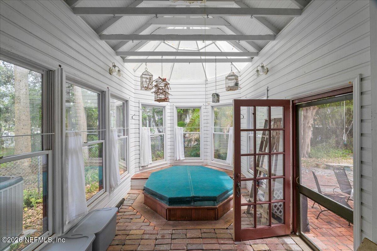 223 Madison Street Palatka, FL 32177 - Photo 21 of 60 a room with large windows and furniture