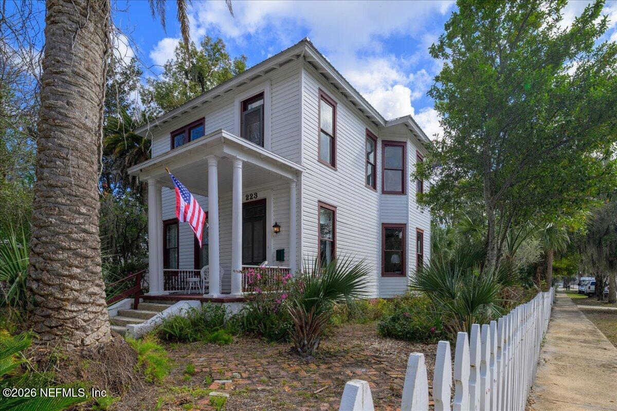 223 Madison Street Palatka, FL 32177 - Photo 3 of 60 a front view of a house with plants