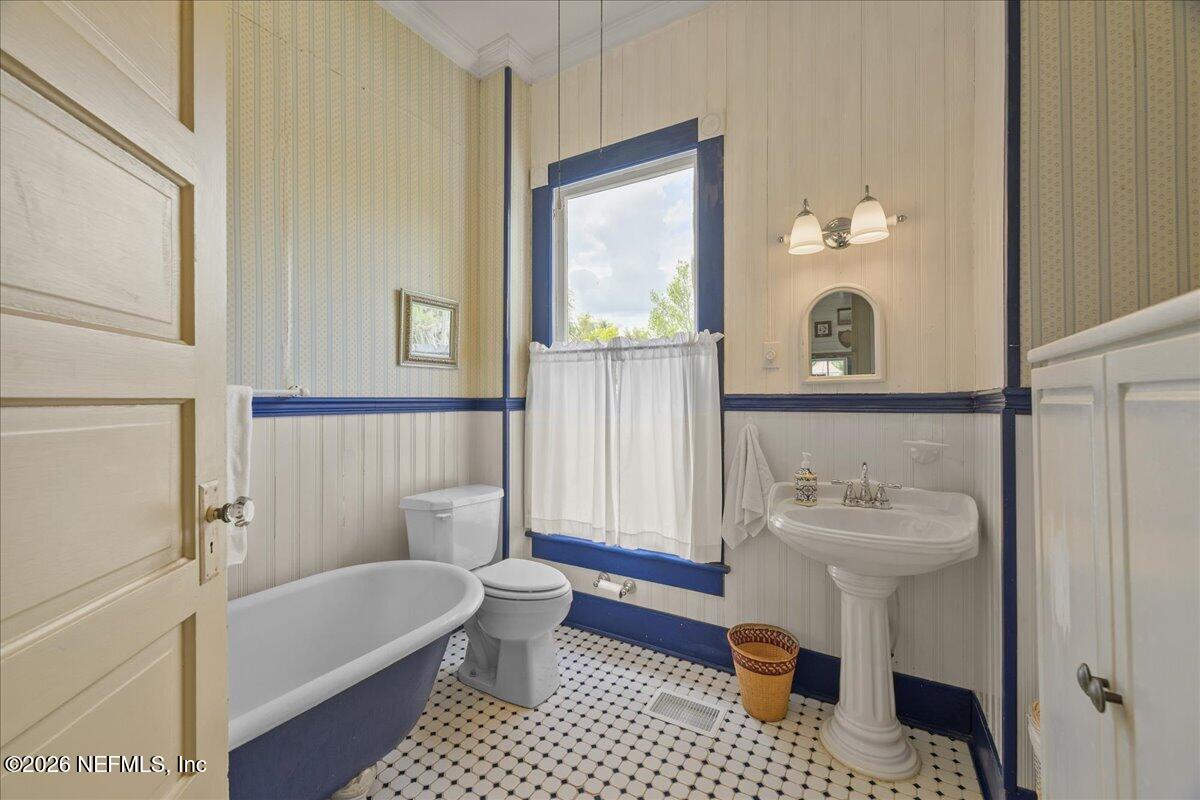 223 Madison Street Palatka, FL 32177 - Photo 33 of 60 a bathroom with a sink toilet and shower