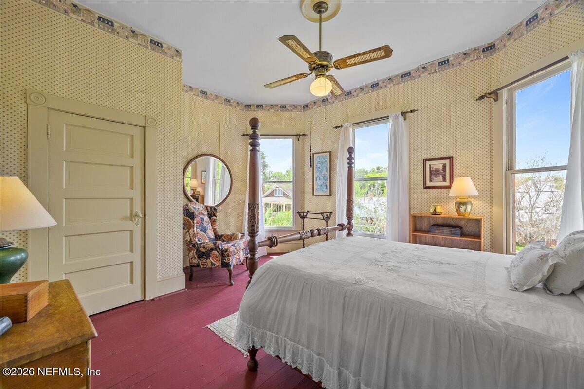 223 Madison Street Palatka, FL 32177 - Photo 34 of 60 a bed room with a bed mirror and a window