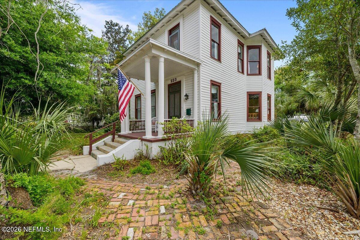223 Madison Street Palatka, FL 32177 - Photo 44 of 60 a front view of a house with garden