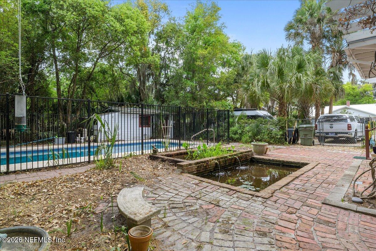223 Madison Street Palatka, FL 32177 - Photo 47 of 60 a view of a backyard with swimming pool and sitting area