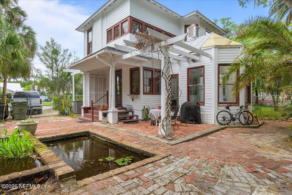 223 Madison Street Palatka, FL 32177 - Photo 48 of 60 a view of a house with swimming pool and sitting area