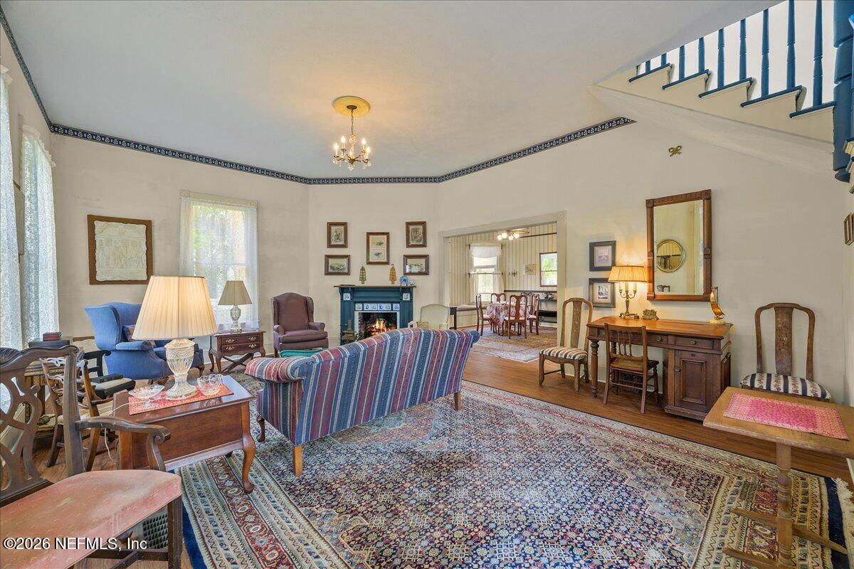223 Madison Street Palatka, FL 32177 - Photo 5 of 60 a living room with furniture a rug and a table