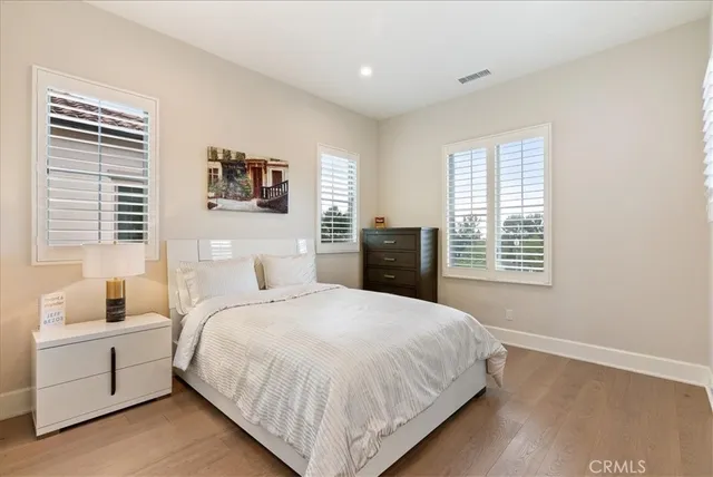 a bedroom with a large bed and a window