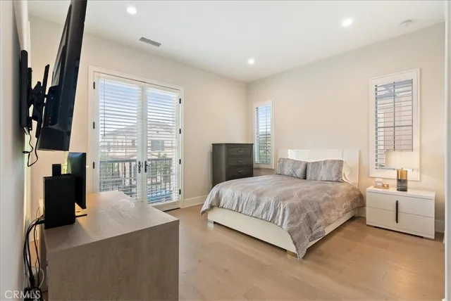 a bedroom with a balcony a bed and a couch