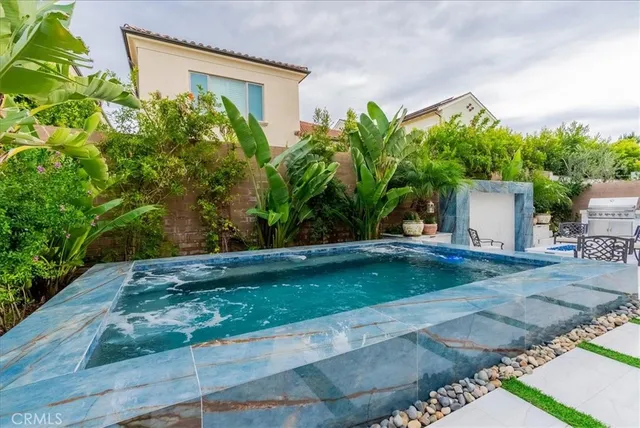a view of a backyard with a garden and plants