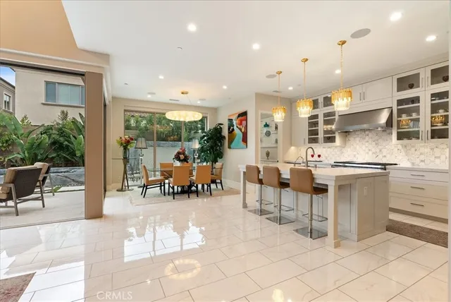 a kitchen with counter top space and dining room