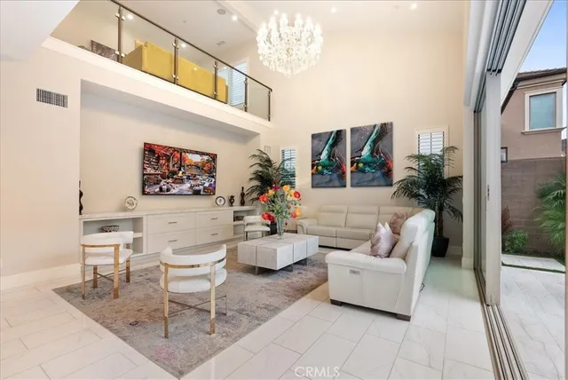 a living room with furniture and a painting on the wall