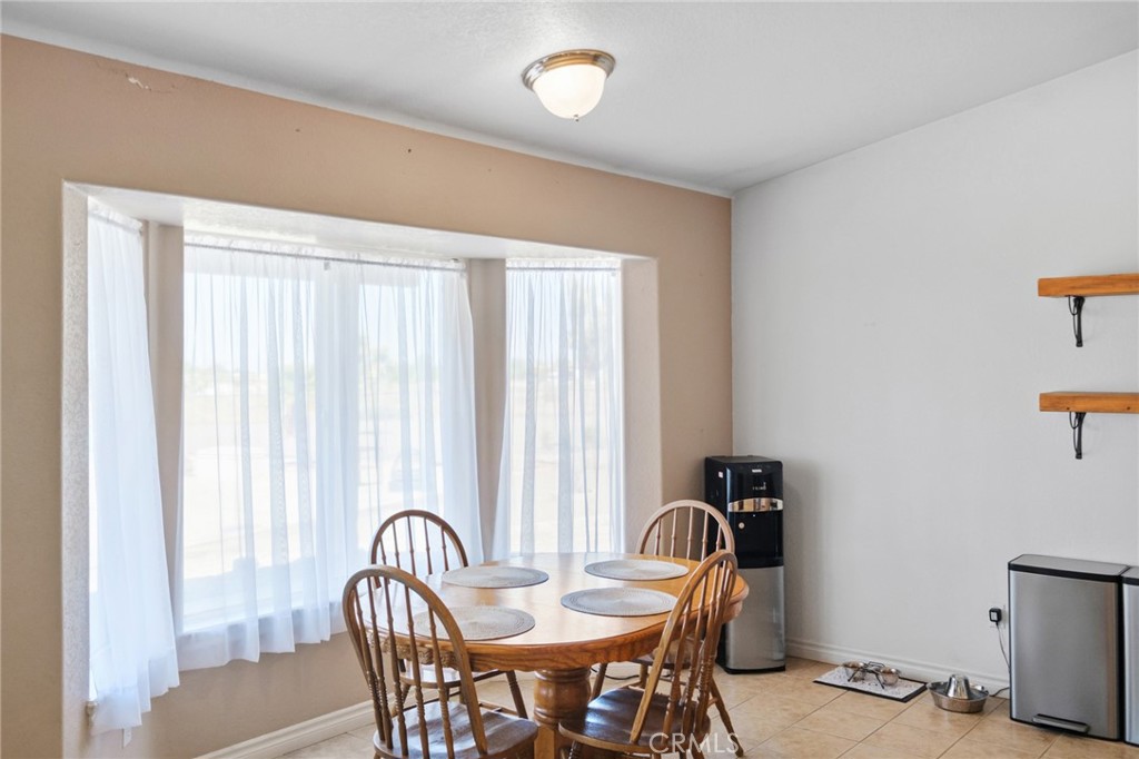 11025 El Esteban Road Phelan, CA 92371 - Photo 16 of 54 a view of a a dining room with furniture window and outside view