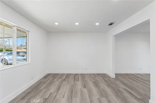a kitchen with granite countertop cabinets stainless steel appliances and a counter space