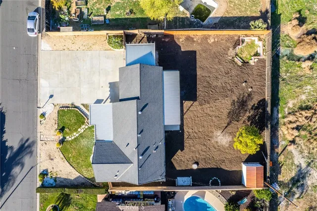 an aerial view of residential houses and outdoor space