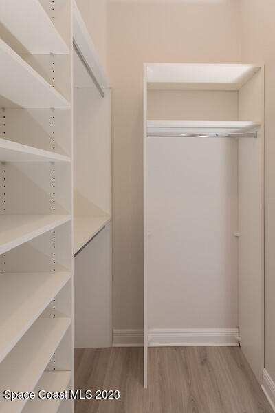 3940 Domain Court Melbourne, FL 32934 - Photo 15 of 27 a view of walk in closet with empty racks