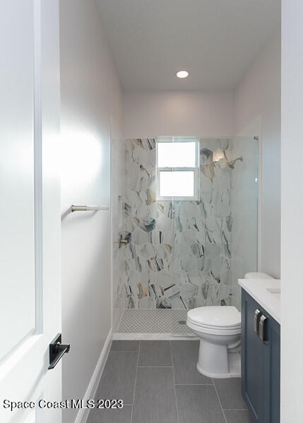 3940 Domain Court Melbourne, FL 32934 - Photo 20 of 27 a bathroom with a toilet and a shower